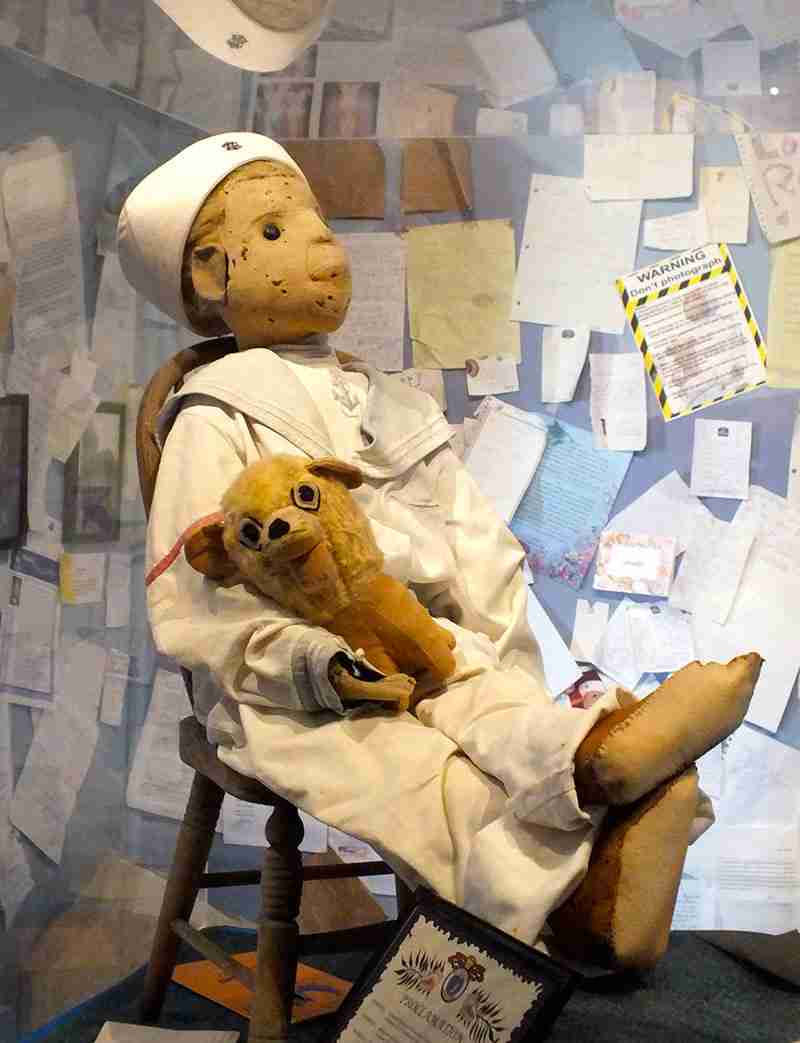 Robert the Doll on display wearing its sailor suit.